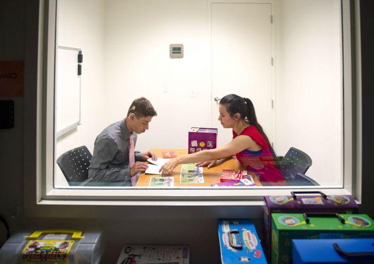 student working with a patient